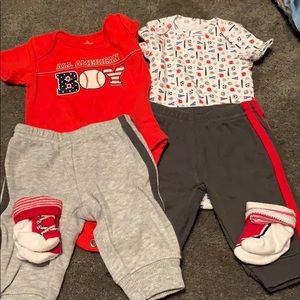 Lot of 2 NB pants & onesie outfits with socks.